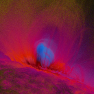 Purple, red, and blue striations show flux ropes on the Sun.
